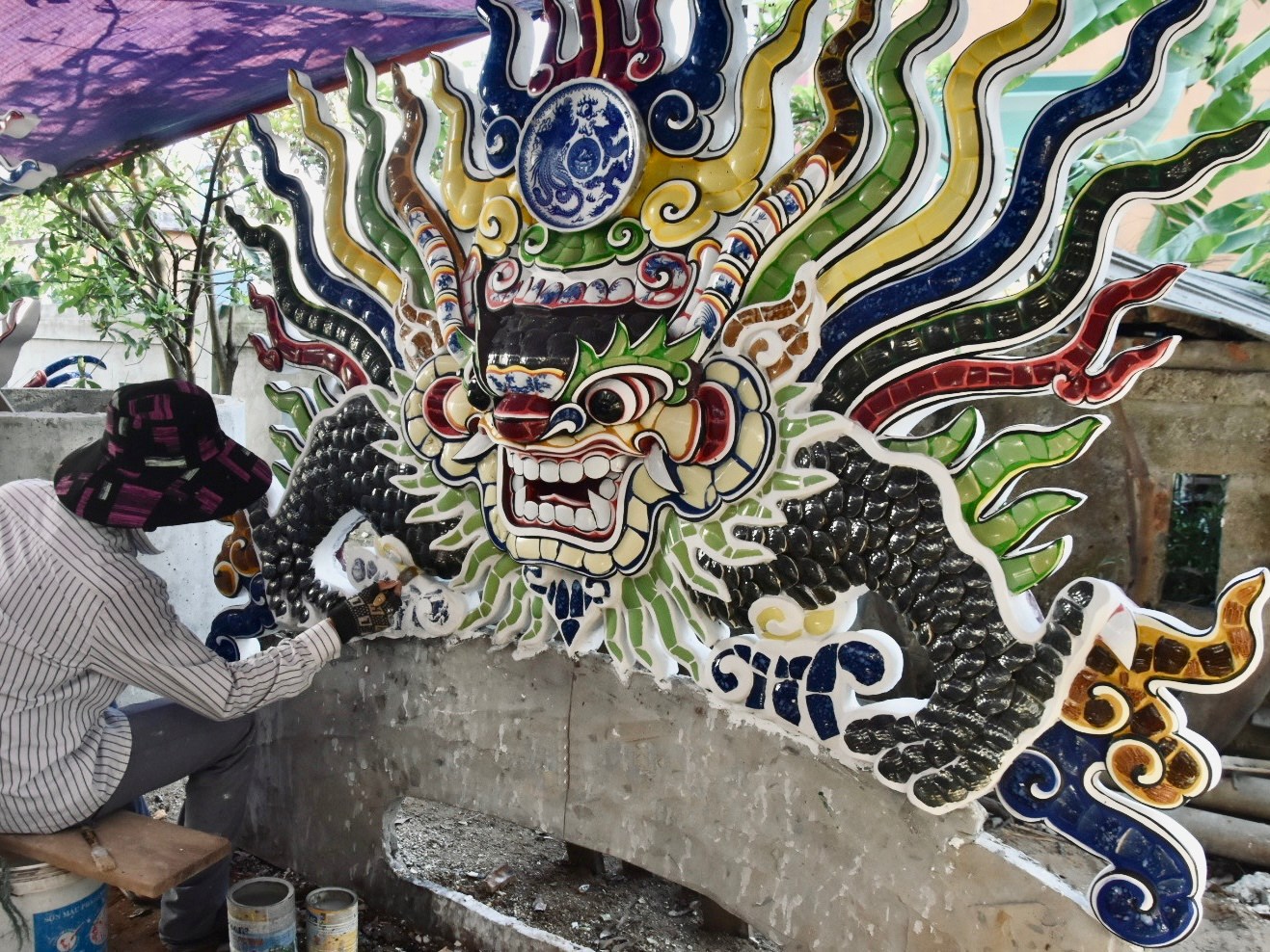 Artisan working on ceramic inlay panel